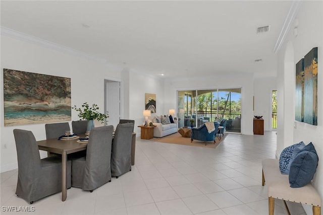 9142 Cherry Oaks Ln Unit 202, Naples, FL 34114 - dining room with light tile patterned floors and crown molding