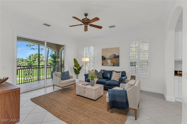 9142 Cherry Oaks Ln Unit 202, Naples, FL 34114 - living room with light tile patterned flooring, arched walkways, ceiling fan, plenty of natural light, and ornamental molding