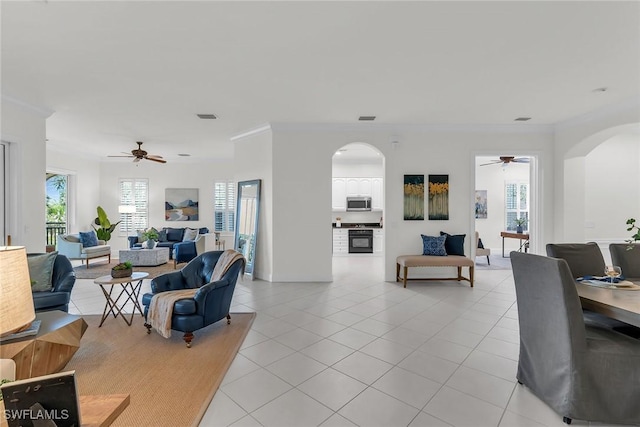 9142 Cherry Oaks Ln Unit 202, Naples, FL 34114 - living area with arched walkways, a ceiling fan, light tile patterned floors, and crown molding