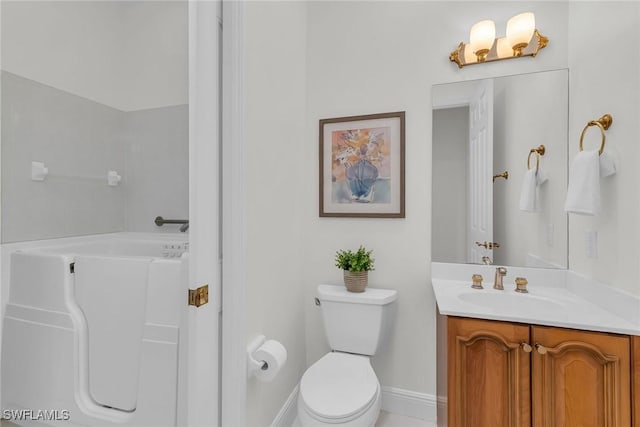 9142 Cherry Oaks Ln Unit 202, Naples, FL 34114 - bathroom with vanity, baseboards, toilet, and a bathtub