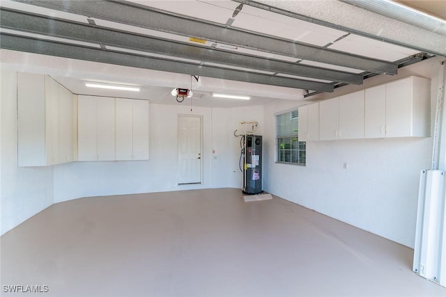 9142 Cherry Oaks Ln Unit 202, Naples, FL 34114 - garage featuring heat pump water heater and a garage door opener