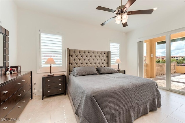 21530 Strada Nuova Cir Unit 215, Estero, FL 33928 - bedroom with access to outside, light tile patterned floors, and ceiling fan