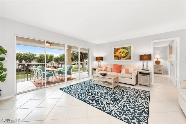 1020 Swallow Ave Unit 102, Marco Island, FL 34145 - living area with light tile patterned flooring and healthy amount of natural light