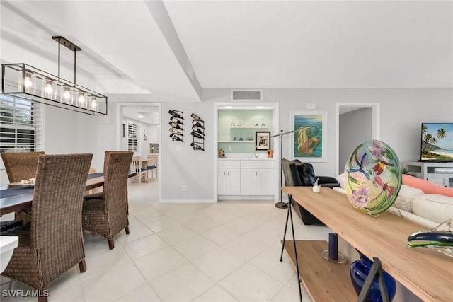 1020 Swallow Ave Unit 102, Marco Island, FL 34145 - dining area featuring light tile patterned floors and baseboards