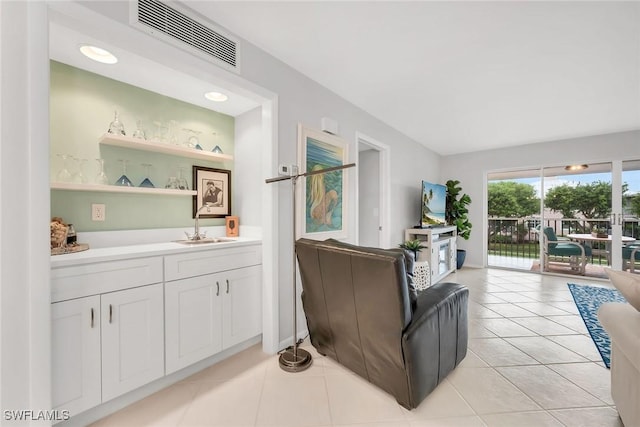 1020 Swallow Ave Unit 102, Marco Island, FL 34145 - living area with light tile patterned floors and bar area