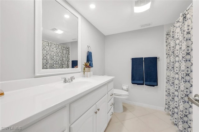 1020 Swallow Ave Unit 102, Marco Island, FL 34145 - bathroom featuring toilet, vanity, and tile patterned floors