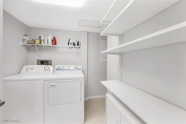 1020 Swallow Ave Unit 102, Marco Island, FL 34145 - laundry room featuring independent washer and dryer, light tile patterned flooring, attic access, and baseboards