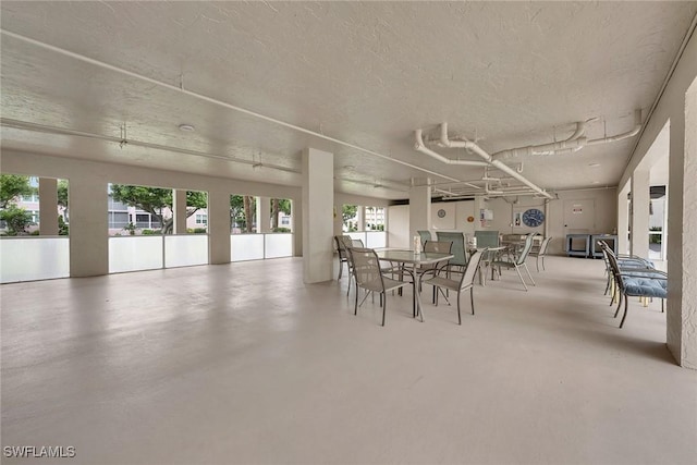 1020 Swallow Ave Unit 102, Marco Island, FL 34145 - dining room with concrete flooring and a textured ceiling