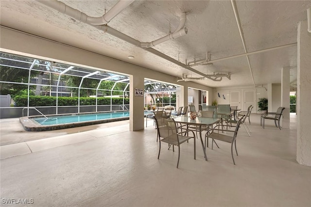 1020 Swallow Ave Unit 102, Marco Island, FL 34145 - dining room featuring a sunroom and concrete flooring