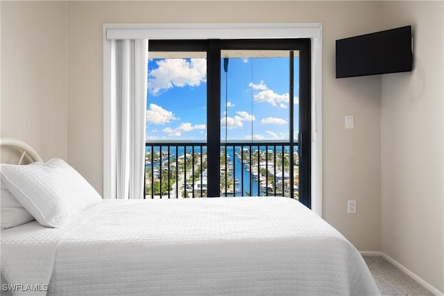 6612 Estero Blvd Unit Ph2, Fort Myers Beach, FL 33931 - bedroom with access to exterior, carpet flooring, and baseboards