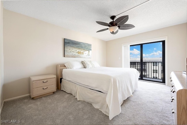 6612 Estero Blvd Unit Ph2, Fort Myers Beach, FL 33931 - bedroom featuring access to outside, light carpet, baseboards, ceiling fan, and a textured ceiling
