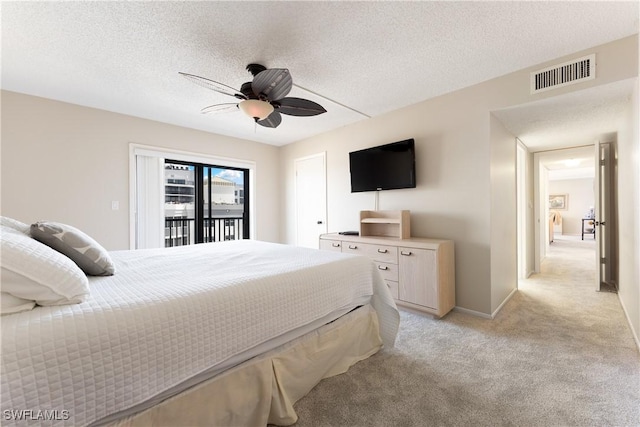 6612 Estero Blvd Unit Ph2, Fort Myers Beach, FL 33931 - bedroom featuring access to outside, light colored carpet, a ceiling fan, a textured ceiling, and baseboards