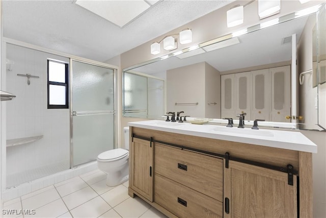 6612 Estero Blvd Unit Ph2, Fort Myers Beach, FL 33931 - full bathroom featuring double vanity, toilet, a shower stall, and tile patterned floors