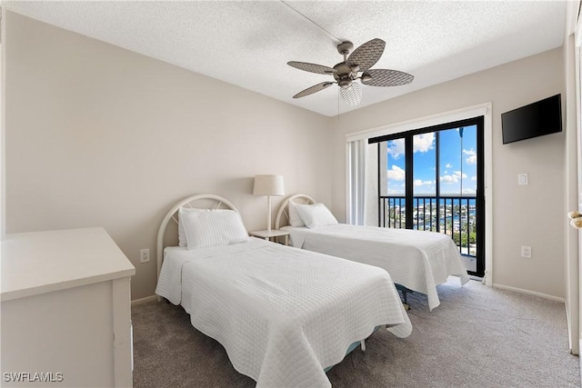 6612 Estero Blvd Unit Ph2, Fort Myers Beach, FL 33931 - bedroom with access to exterior, carpet flooring, baseboards, ceiling fan, and a textured ceiling