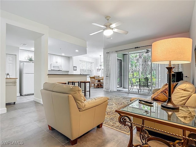 1732 Tarpon Bay Dr S Unit 101, Naples, FL 34119 - living room with a ceiling fan
