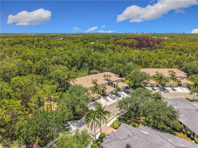 1732 Tarpon Bay Dr S Unit 101, Naples, FL 34119 - aerial perspective of suburban area featuring a heavily wooded area