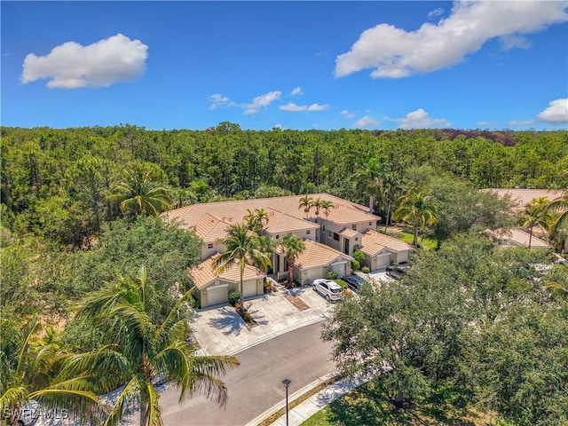 1732 Tarpon Bay Dr S Unit 101, Naples, FL 34119 - aerial view of property and surrounding area featuring a forest