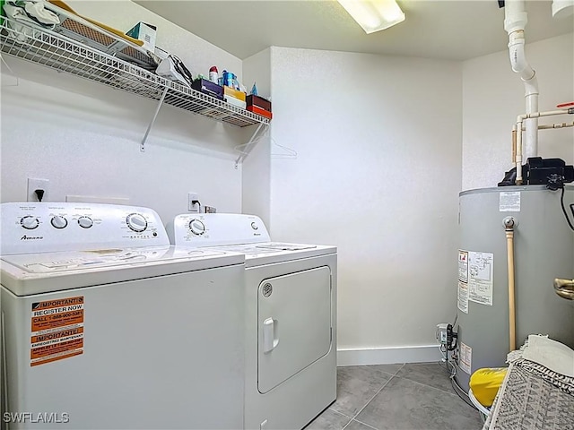 1732 Tarpon Bay Dr S Unit 101, Naples, FL 34119 - washroom featuring separate washer and dryer, water heater, and baseboards