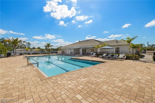 309 Spiaggio Ct, Naples, FL 34114 - community pool with fence and a patio area