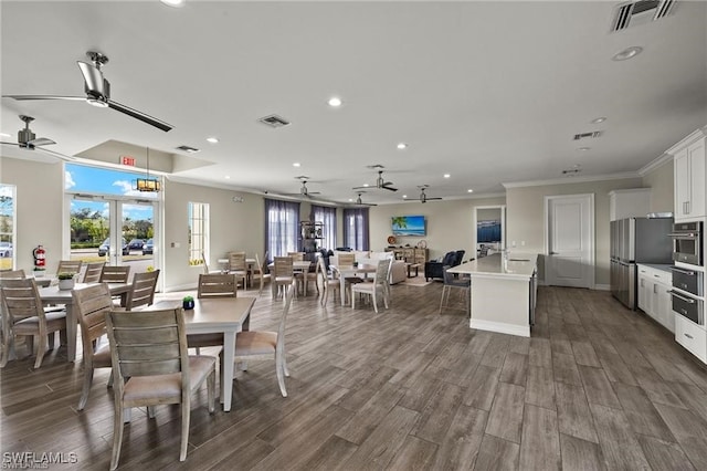 309 Spiaggio Ct, Naples, FL 34114 - dining area with ceiling fan, recessed lighting, dark wood finished floors, and crown molding