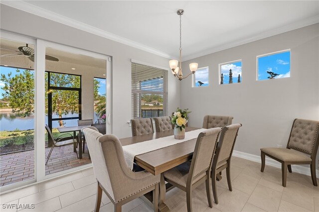 309 Spiaggio Ct, Naples, FL 34114 - dining room with crown molding, a chandelier, light tile patterned floors, a water view, and baseboards