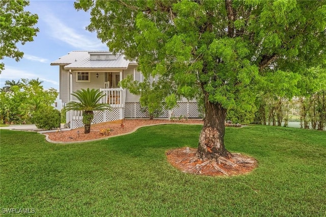 7269 Heaven Ln, Fort Myers, FL 33908 - view of green lawn featuring covered porch
