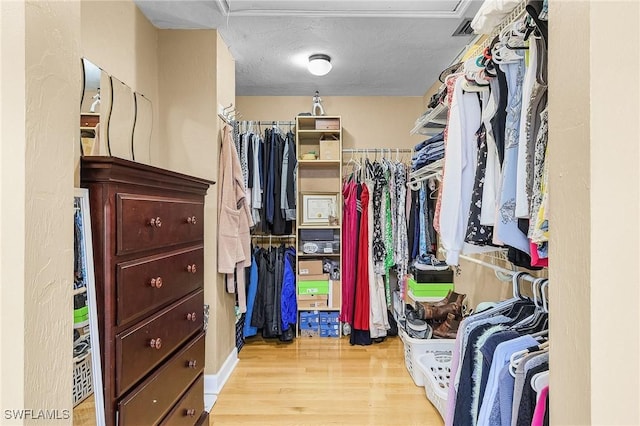 7269 Heaven Ln, Fort Myers, FL 33908 - walk in closet featuring wood finished floors
