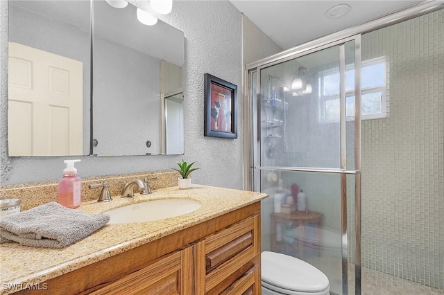7269 Heaven Ln, Fort Myers, FL 33908 - full bath with a textured wall, a shower stall, vanity, and toilet