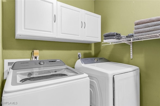 7269 Heaven Ln, Fort Myers, FL 33908 - laundry room with cabinet space and washing machine and clothes dryer