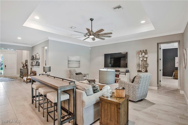 8651 Colony Trace Dr, Fort Myers, FL 33908 - living room featuring a tray ceiling, recessed lighting, ceiling fan, crown molding, and baseboards
