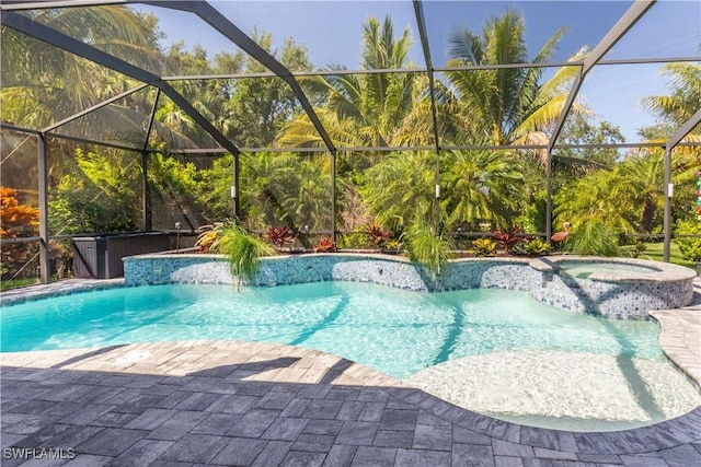 8651 Colony Trace Dr, Fort Myers, FL 33908 - view of swimming pool with a lanai, a pool with connected hot tub, and a patio area