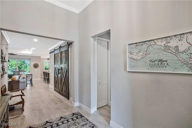 8651 Colony Trace Dr, Fort Myers, FL 33908 - hall featuring a barn door, ornamental molding, baseboards, and recessed lighting