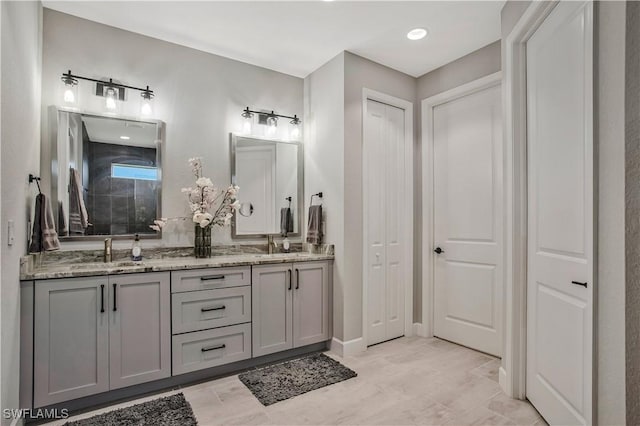 8651 Colony Trace Dr, Fort Myers, FL 33908 - bathroom with double vanity, tiled shower, and recessed lighting