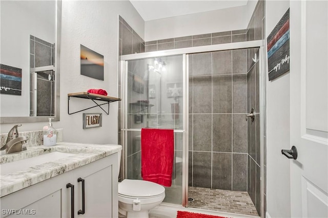 8651 Colony Trace Dr, Fort Myers, FL 33908 - bathroom featuring a stall shower, toilet, and vanity