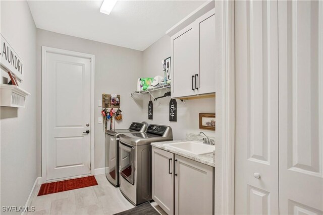 8651 Colony Trace Dr, Fort Myers, FL 33908 - laundry room featuring washer and dryer, cabinet space, and baseboards