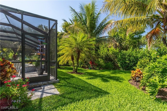 8651 Colony Trace Dr, Fort Myers, FL 33908 - view of green lawn with glass enclosure