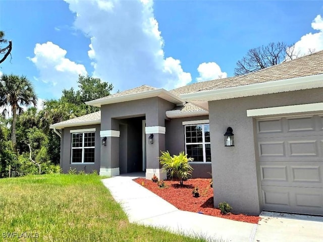 2201 Como St, Port Charlotte, FL 33948 - property entrance featuring stucco siding and a garage