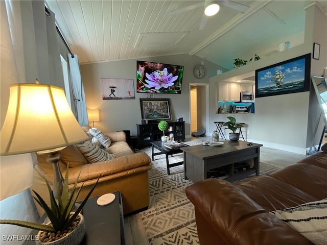 17133 Phlox Dr, Fort Myers, FL 33967 - living room with vaulted ceiling, baseboards, and a ceiling fan