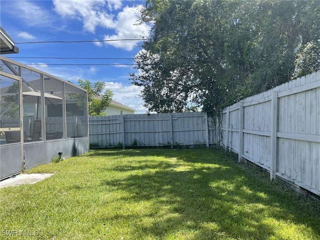 17133 Phlox Dr, Fort Myers, FL 33967 - view of yard featuring glass enclosure