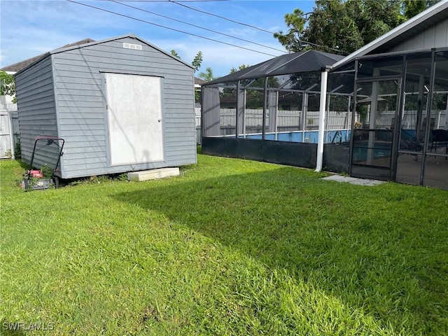 17133 Phlox Dr, Fort Myers, FL 33967 - view of green lawn featuring a shed, an outdoor structure, and a lanai