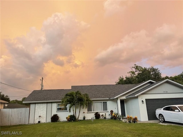 17133 Phlox Dr, Fort Myers, FL 33967 - ranch-style home featuring an attached garage, stucco siding, and a shingled roof