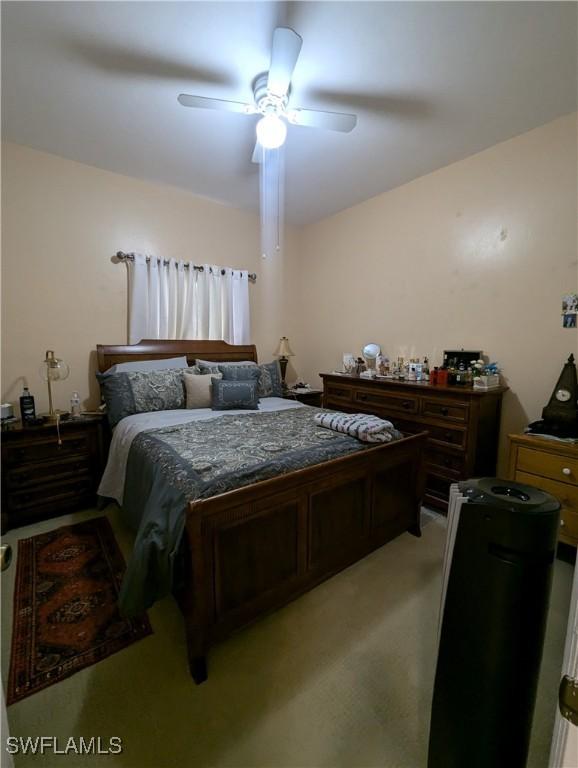 1711 NW 28th Ter, Cape Coral, FL 33993 - bedroom featuring ceiling fan and light colored carpet