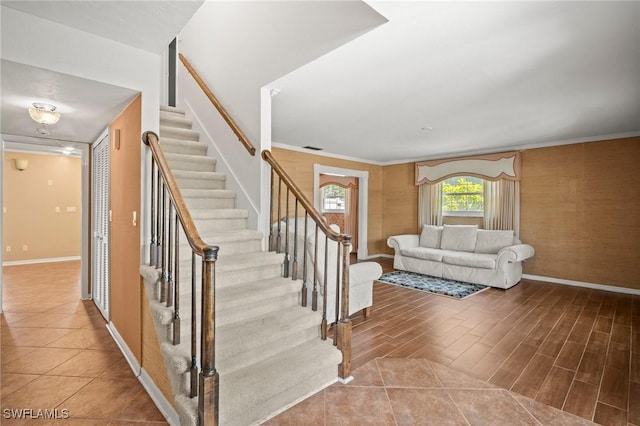 1263 Caloosa Dr, Fort Myers, FL 33901 - stairway with baseboards, ornamental molding, and wood finished floors
