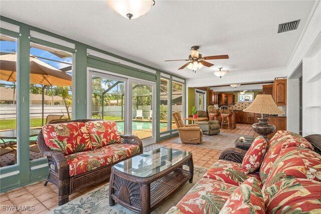 1263 Caloosa Dr, Fort Myers, FL 33901 - sunroom with french doors and tile patterned flooring