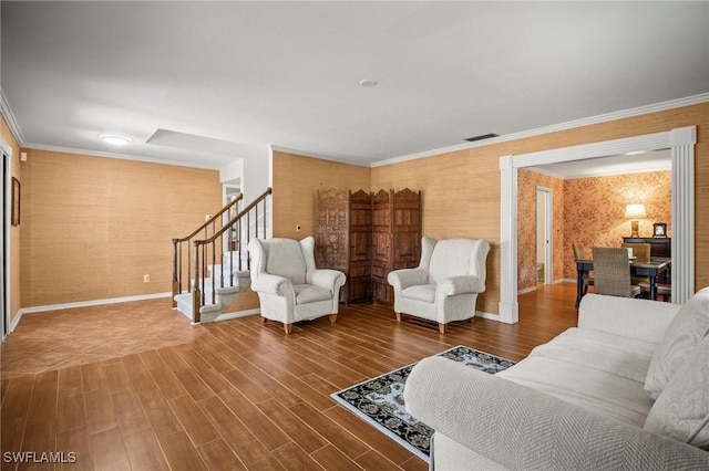 1263 Caloosa Dr, Fort Myers, FL 33901 - living room with stairs, wood finished floors, wallpapered walls, baseboards, and ornamental molding