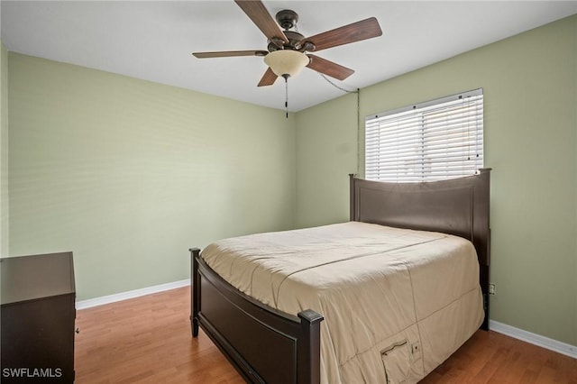 1263 Caloosa Dr, Fort Myers, FL 33901 - bedroom featuring wood finished floors, baseboards, and a ceiling fan