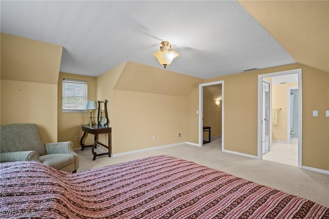 1263 Caloosa Dr, Fort Myers, FL 33901 - carpeted bedroom featuring vaulted ceiling, baseboards, and connected bathroom
