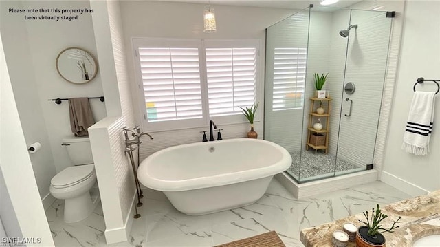 718 Reef Point Cir, Naples, FL 34108 - full bath featuring marble finish floors, a freestanding bath, baseboards, and a stall shower