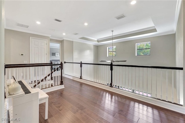 2102 Antigua Ln, Naples, FL 34120 - corridor featuring crown molding, an upstairs landing, wood finished floors, a raised ceiling, and recessed lighting