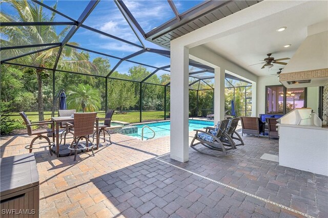 2102 Antigua Ln, Naples, FL 34120 - view of patio featuring ceiling fan, an outdoor pool, glass enclosure, and outdoor dining area